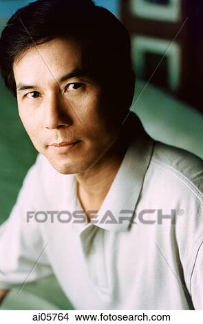 Picture - Man in polo shirt, portrait. Fotosearch