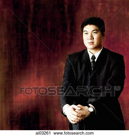 Man in suit, sitting, portrait View Large Photo Image Stock Image - Man in suit, sitting, portrait. Fotosearch
