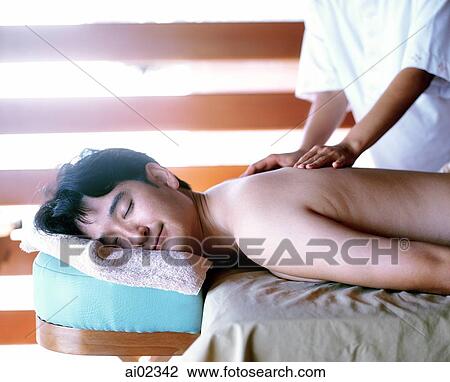 Man on table getting massage View Large Photo Image Stock Image - Man on table getting massage. Fotosearch
