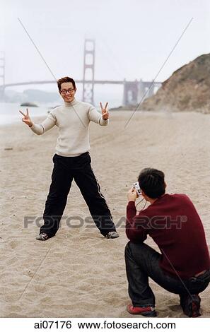 Man posing in front of camera View Large Photo Image Stock Photograph - Man posing in front of camera. Fotosearch