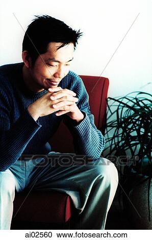 Man sitting and resting head on hands View Large Photo Image Stock Image - Man sitting and resting head on hands. Fotosearch