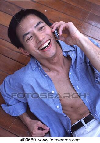 Man talking on cellular phone, laughing View Large Photo Image Stock Image - Man talking on cellular phone, laughing. Fotosearch