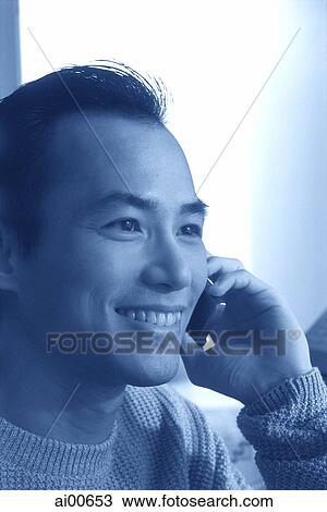 Stock Image - Man talking on cellular phone. Fotosearch