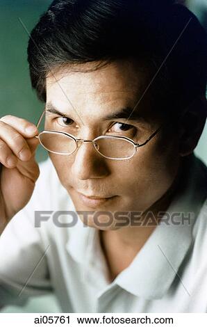 Man tipping glasses, portrait View Large Photo Image Stock Image - Man tipping glasses, portrait. Fotosearch