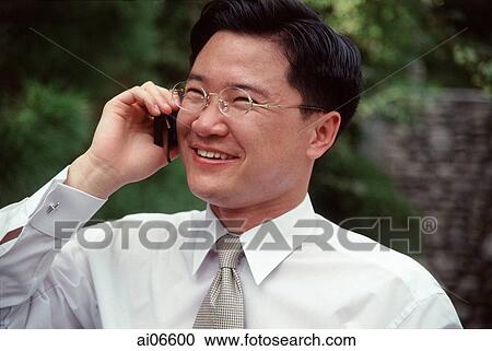 Man using mobile phone, head shot View Large Photo Image Stock Image - Man using mobile phone, head shot. Fotosearch