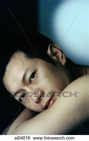 Man with arm wrapped around himself, portrait View Large Photo Image Stock Photograph - Man with arm wrapped around himself, portrait. Fotosearch