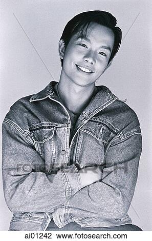 Man with arms folded, smiling, portrait ( high grain) View Large Photo Image Stock Image - Man with arms folded, smiling, portrait ( high grain). Fotosearch