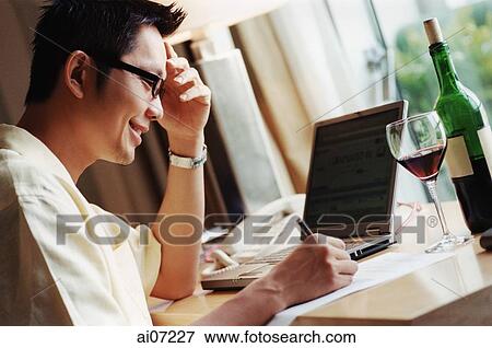 Man writing, smiling View Large Photo Image Stock Photo - Man writing, smiling. Fotosearch