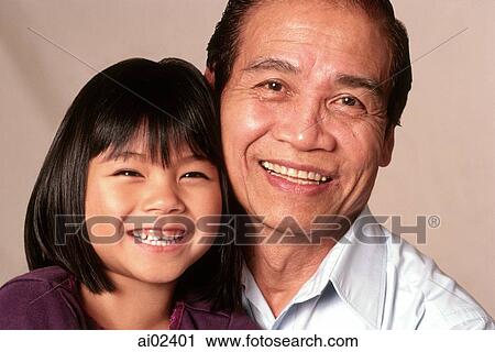 Mature man and young girl, portrait View Large Photo Image Stock Image - Mature man and young girl, portrait. Fotosearch