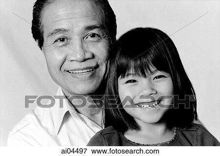 Stock Photo - Mature man hugging young girl. Fotosearch