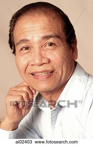 Mature man resting hand on chin, smiling, portrait View Large Photo Image Stock Image - Mature man resting hand on chin, smiling, portrait. Fotosearch