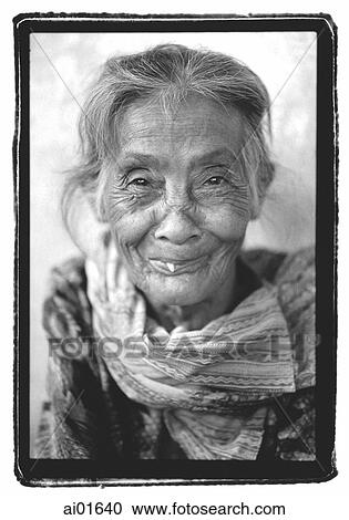 Mature woman wearing scarf, portrait View Large Photo Image Stock Image - Mature woman wearing scarf, portrait. Fotosearch