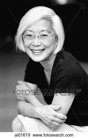 Mature woman with arms crossed, portrait View Large Photo Image Stock Photo - Mature woman with arms crossed, portrait. Fotosearch