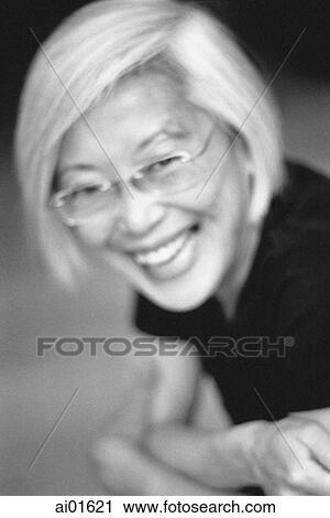 Mature woman with glasses, laughing, portrait View Large Photo Image Stock Image - Mature woman with glasses, laughing, portrait. Fotosearch