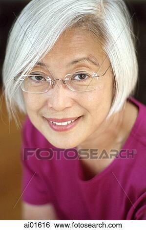 Mature woman with glasses, portrait View Large Photo Image Stock Photograph - Mature woman with glasses, portrait. Fotosearch