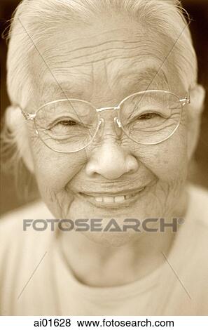 Mature woman with glasses, smiling, portrait View Large Photo Image Stock Photo - Mature woman with glasses, smiling, portrait. Fotosearch
