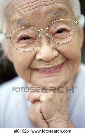 Mature woman with glasses smiling, portrait View Large Photo Image Stock Photography - Mature woman with glasses smiling, portrait. Fotosearch