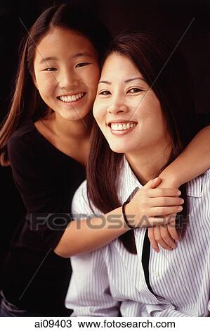 Mother and daughter, smiling, hugging View Large Photo Image Stock Image - Mother and daughter, smiling, hugging. Fotosearch