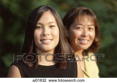 Mother and daughter smiling, portrait View Large Photo Image Stock Image - Mother and daughter smiling, portrait. Fotosearch