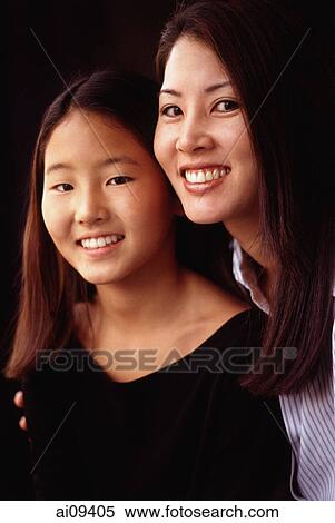 Mother and daughter, smiling, portrait View Large Photo Image Stock Photography - Mother and daughter, smiling, portrait. Fotosearch