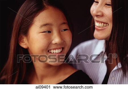 Mother and daughter, smiling View Large Photo Image Stock Image - Mother and daughter, smiling. Fotosearch