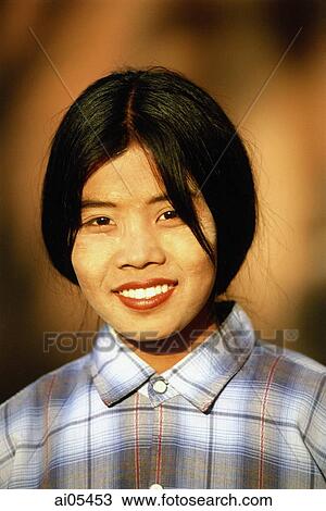 Myanmar (Burma), Bagan, Portrait of woman with painted face View Large Photo Image Stock Image - Myanmar (Burma), Bagan, Portrait of woman with painted face. Fotosearch