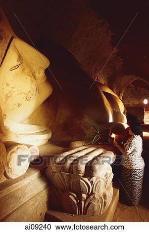 Myanmar (Burma), Bagan, Women worshippers praying at reclining Buddha - Shinbinthalyaung. View Large Photo Image Stock Image - Myanmar (Burma), Bagan, Women worshippers praying at reclining Buddha - Shinbinthalyaung.. Fotosearch