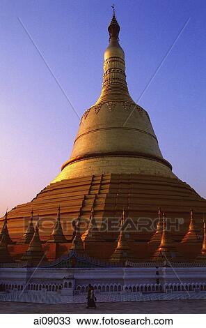 Myanmar (Burma), Bago, Women walking beneath the golden stupa at Shwemawdaw Paya. View Large Photo Image Stock Image - Myanmar (Burma), Bago, Women walking beneath the golden stupa at Shwemawdaw Paya.. Fotosearch