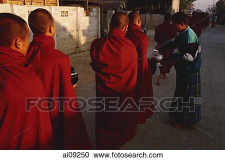 Myanmar (Burma), Inle lake, Buddhist monks receiving alms. View Large Photo Image Stock Image - Myanmar (Burma), Inle lake, Buddhist monks receiving alms.. Fotosearch