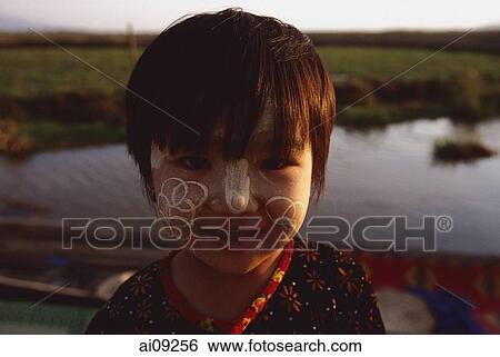 Myanmar (Burma), Inle lake, Girl with interesting bark patterns on her face. View Large Photo Image Stock Photograph - Myanmar (Burma), Inle lake, Girl with interesting bark patterns on her face.. Fotosearch
