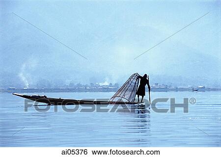 Myanmar (Burma), Inle Lake, silhouette of fisherman in boat on Inie Lake View Large Photo Image Stock Photograph - Myanmar (Burma), Inle Lake, silhouette of fisherman in boat on Inie Lake. Fotosearch
