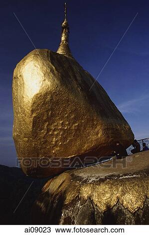 Stock Image - Myanmar (Burma), Kyaiktiyo, Worshippers at 'golden rock'.. Fotosearch