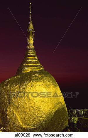 Myanmar (Burma), Kyaiktiyo, Worshippers at 'golden rock' at sunset. View Large Photo Image Stock Photo - Myanmar (Burma), Kyaiktiyo, Worshippers at 'golden rock' at sunset.. Fotosearch