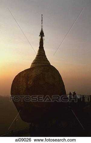 Myanmar (Burma), Kyaiktiyo, Worshippers at 'golden rock' at sunset. View Large Photo Image Stock Photograph - Myanmar (Burma), Kyaiktiyo, Worshippers at 'golden rock' at sunset.. Fotosearch