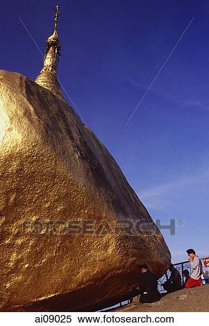 Stock Photography - Myanmar (Burma), Kyaiktiyo, Worshippers at 'golden rock'.. Fotosearch