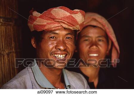Myanmar (Burma), Near Kalaw, Pa-o couple in doorway of traditional house. View Large Photo Image Stock Photo - Myanmar (Burma), Near Kalaw, Pa-o couple in doorway of traditional house.. Fotosearch