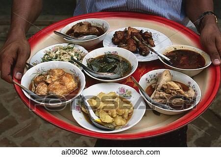 Myanmar (Burma), New Bagan, Selection of Burmese food on tray held by waiter. View Large Photo Image Stock Image - Myanmar (Burma), New Bagan, Selection of Burmese food on tray held by waiter.. Fotosearch