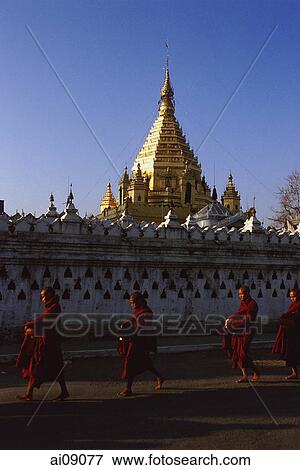 Myanmar (Burma), Nyaungshwe, Inle lake, Buddhist monks walking pass Yadanaman Aung Paya. View Large Photo Image Stock Photo - Myanmar (Burma), Nyaungshwe, Inle lake, Buddhist monks walking pass Yadanaman Aung Paya.. Fotosearch