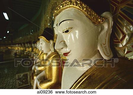 Myanmar (Burma), Sangaing Hills, Mandalay, Line of Buddha statues at Onhmin Thonze. View Large Photo Image Stock Photograph - Myanmar (Burma), Sangaing Hills, Mandalay, Line of Buddha statues at Onhmin Thonze.. Fotosearch