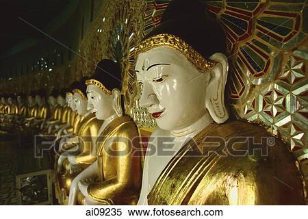 Myanmar (Burma), Sangaing Hills, Mandalay, Line of Buddha statues at Onhmin Thonze. View Large Photo Image Stock Photography - Myanmar (Burma), Sangaing Hills, Mandalay, Line of Buddha statues at Onhmin Thonze.. Fotosearch