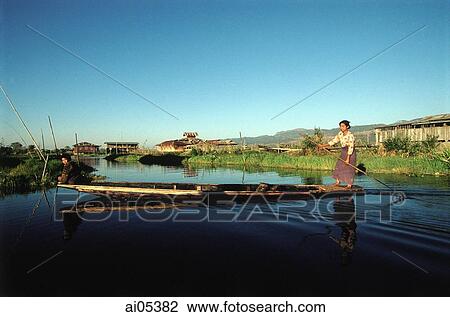 Myanmar (Burma), Woman rowing boat on Inle Lake View Large Photo Image Stock Image - Myanmar (Burma), Woman rowing boat on Inle Lake. Fotosearch