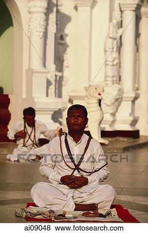 Myanmar (Burma), Yangon, Ascetic man stares into sun whilst meditating at Shwedagon Paya. View Large Photo Image Stock Photo - Myanmar (Burma), Yangon, Ascetic man stares into sun whilst meditating at Shwedagon Paya.. Fotosearch
