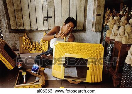 Myanmar (Burma), Yangon (Rangoon), A Craftsman putting finishing touches on a souvenir for sale at one of hundreds of shops outside of the Shwedagon Pagoda. View Large Photo Image Stock Image - Myanmar (Burma), Yangon (Rangoon), A Craftsman putting finishing touches on a souvenir for sale at one of hundreds of shops outside of the Shwedagon Pagoda.. Fotosearch