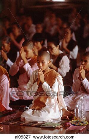 Myanmar (Burma), Yangon (Rangoon), A group of young Buddhist monks meditating at a meditation center. View Large Photo Image Stock Photo - Myanmar (Burma), Yangon (Rangoon), A group of young Buddhist monks meditating at a meditation center.. Fotosearch