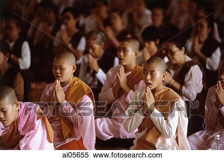Myanmar (Burma), Yangon (Rangoon), A group of young Buddhist monks and other Buddhists meditating at a meditation center. View Large Photo Image Stock Photography - Myanmar (Burma), Yangon (Rangoon), A group of young Buddhist monks and other Buddhists meditating at a meditation center.. Fotosearch