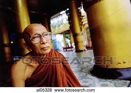 Myanmar (Burma), Yangon (Rangoon), An elderly Buddhist monk sitting at a meditation center. View Large Photo Image Stock Photo - Myanmar (Burma), Yangon (Rangoon), An elderly Buddhist monk sitting at a meditation center.. Fotosearch