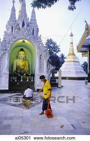 Myanmar (Burma), Yangon (Rangoon), Man sweeping tiles at Shwedagon Pagoda, man praying in background. View Large Photo Image Stock Image - Myanmar (Burma), Yangon (Rangoon), Man sweeping tiles at Shwedagon Pagoda, man praying in background.. Fotosearch