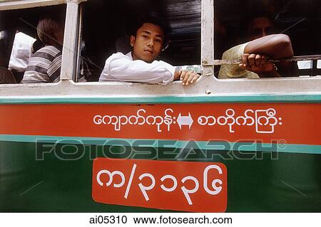 Myanmar (Burma), Yangon (Rangoon), Passengers looking out the windows of a bus. View Large Photo Image Stock Image - Myanmar (Burma), Yangon (Rangoon), Passengers looking out the windows of a bus.. Fotosearch