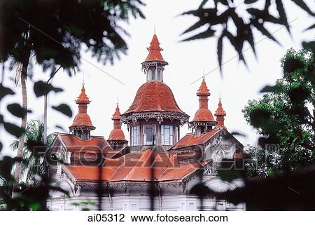 Myanmar (Burma), Yangon (Rangoon), Spires of a colonial building peeking over foliage. View Large Photo Image Stock Image - Myanmar (Burma), Yangon (Rangoon), Spires of a colonial building peeking over foliage.. Fotosearch
