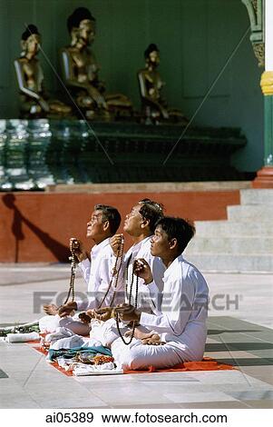 Myanmar (Burma), Yangon (Rangoon), Worshippers praying at the Shwedagon Pagoda View Large Photo Image Stock Photo - Myanmar (Burma), Yangon (Rangoon), Worshippers praying at the Shwedagon Pagoda. Fotosearch